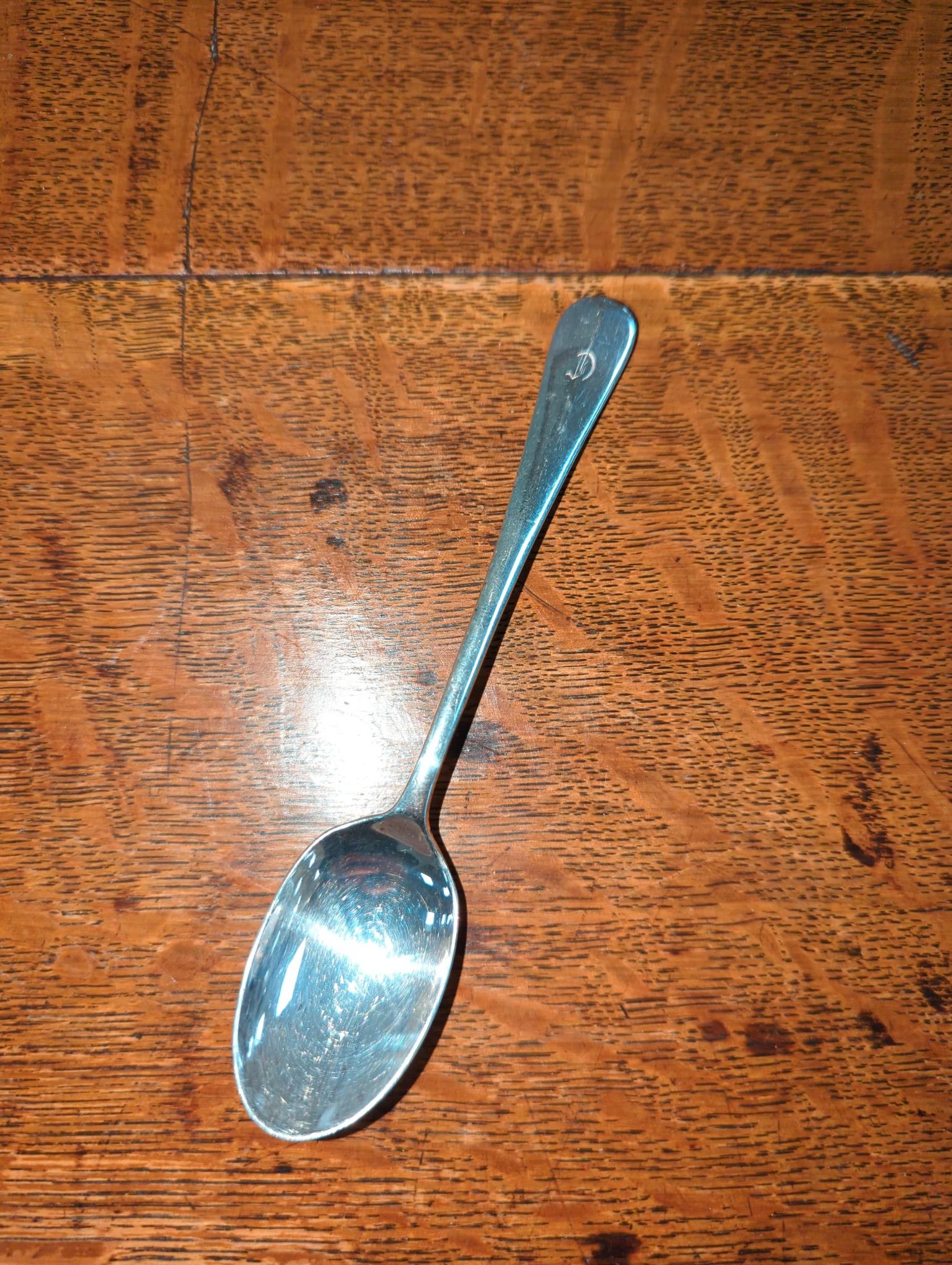 An Edwardian oak cased silver plated table canteen, settings for twelve and a set of silver plated fish knives and forks for twelve